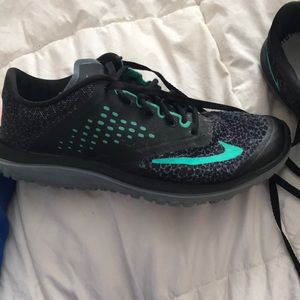 Black and teal Nike shoes